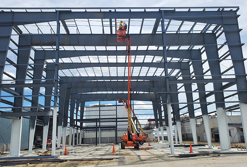 Construction workers erecting steel structure